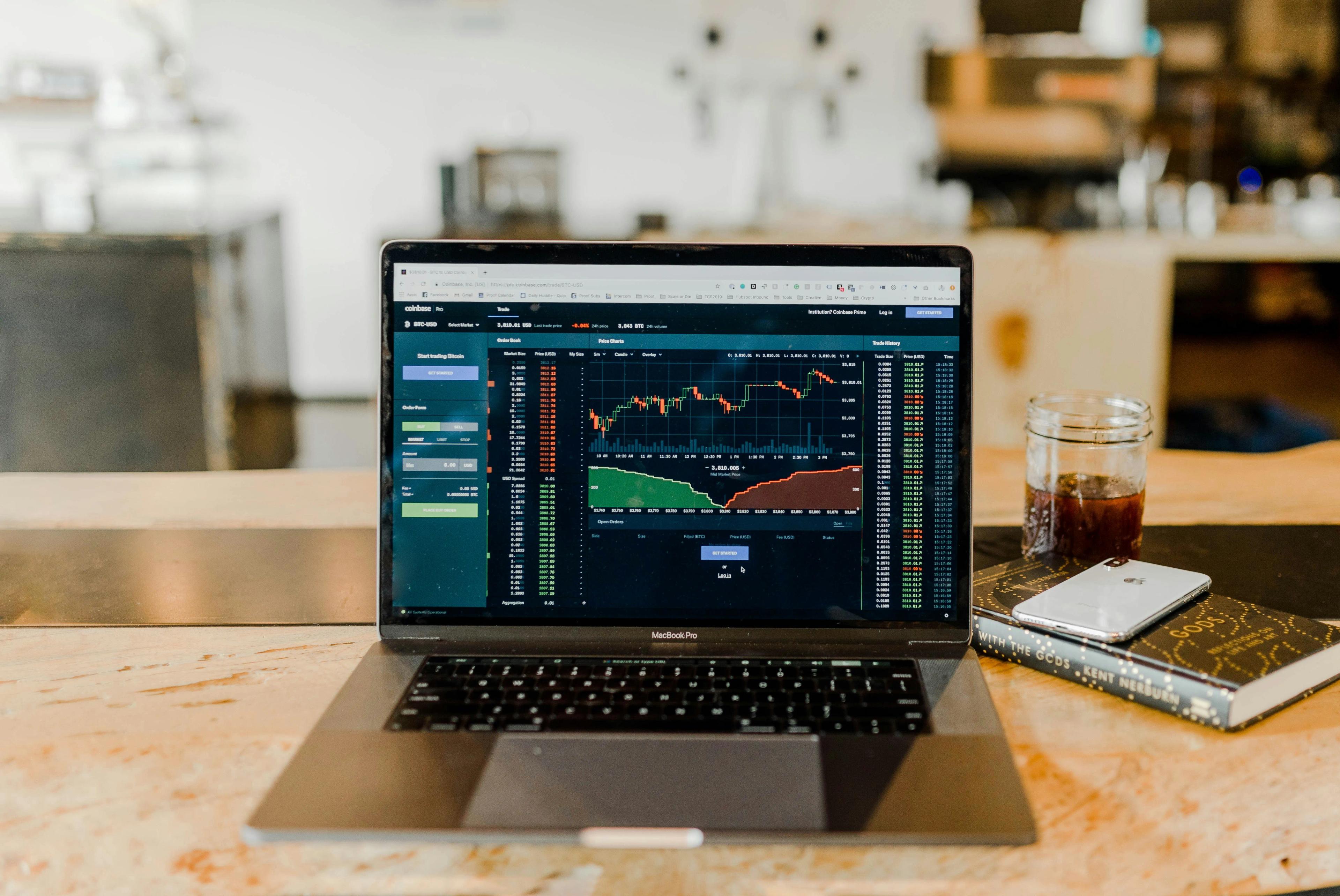 Laptop with price charts open for crypto trading 