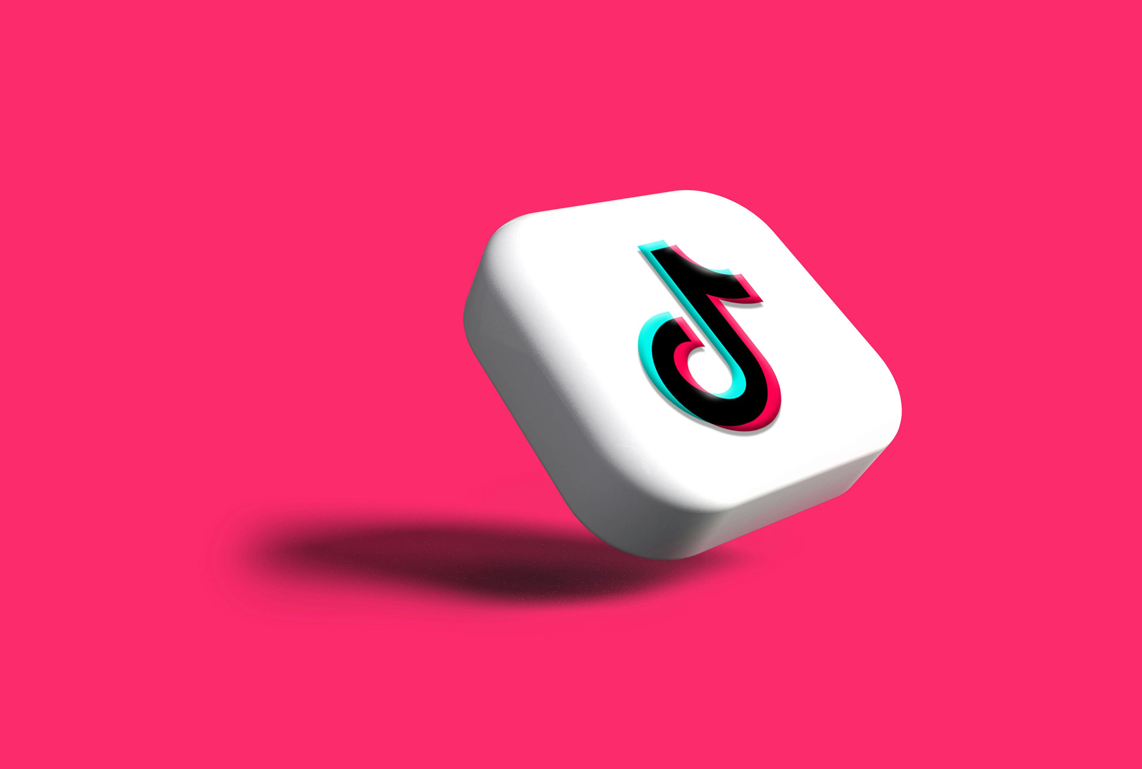 TikTok logo on a pink background